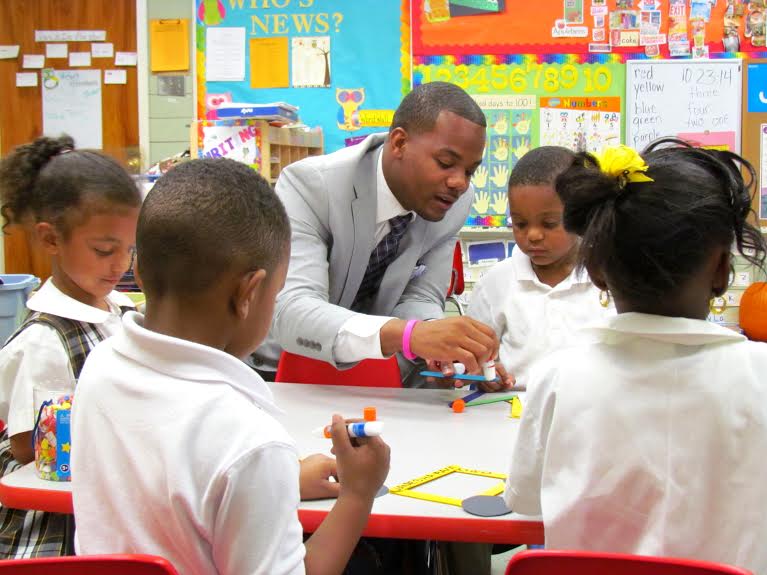 Ethan Ashley with students